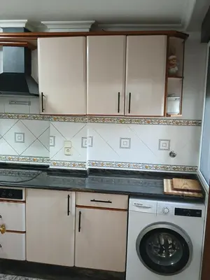 a kitchen with a washer and a washing machine at San Juan in Alborache