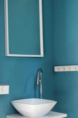 a bathroom with a white sink and a mirror at Playa Cabañyal - Diseño Mediterraneo in Valencia