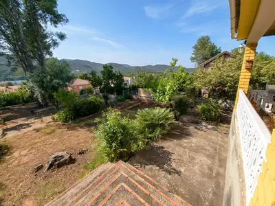 a view of the yard from the porch of a house at Casa Rustica en Las MONTAÑAS in Tales