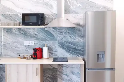 a kitchen with a refrigerator and a microwave at PTZ 1B - Loft Valencia in Valencia