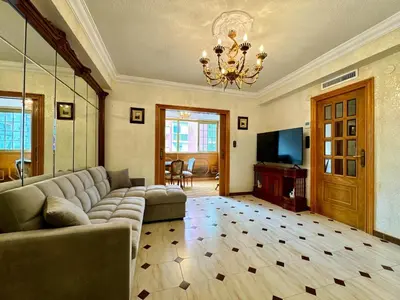 a living room with a couch and a television at Wagner Playa Apartment in Cullera