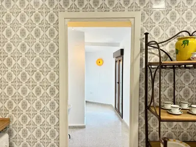 a hallway with a wall covered in wallpaper at Your stylish retreat in Sierra Espadán in Vall de Almonacid