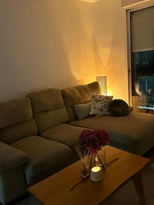 a living room with a couch and a coffee table at Abadesa Apartments in Benetúser
