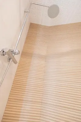 a shower with wooden blinds in a bathroom at Marina Azura in Valencia