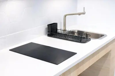 a kitchen counter with a sink and a sinkiterator at Olmaya Flats Valencia in Valencia