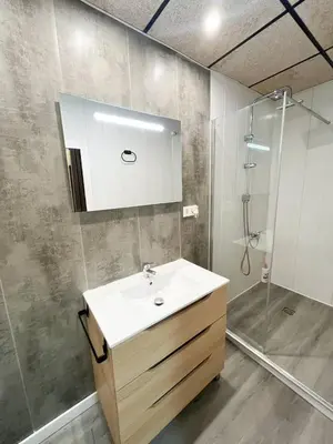a bathroom with a sink and a shower at Casa Burriana con sauna in Burriana