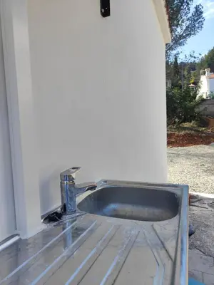 a metal sink with a faucet in a house at Chalet con piscina dogfriendly in Algar de Palancia
