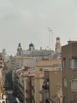 an aerial view of a city with buildings at Ático en el centro con terraza in Valencia