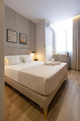 a bedroom with a large white bed in a room at Rubio Rooms by Concept in Valencia