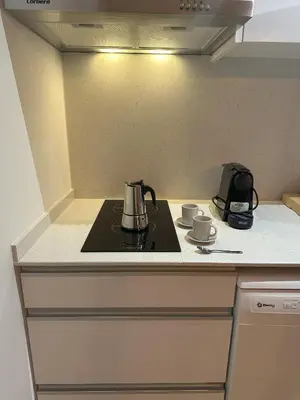 a kitchen counter with a tea kettle on a stove at Valencia Breeze in Alaquas