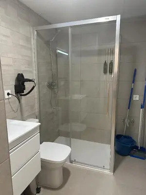 a bathroom with a shower with a toilet and a sink at Valencia Breeze in Alaquas
