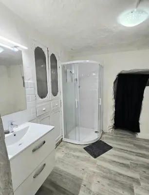 a bathroom with a shower and a sink at Casa Cueva Puerta Verde in Paterna