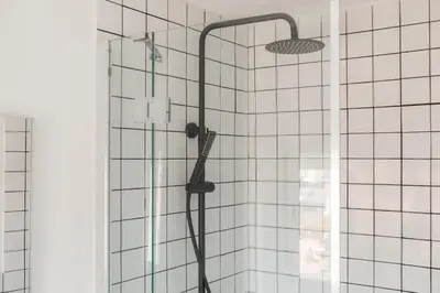 a shower with a shower head in a bathroom at Penthouse with Terrace 2 Bedrooms 2 Bathrooms in Valencia