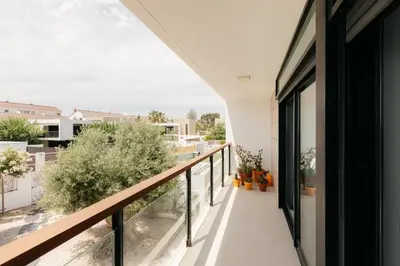 a balcony with a view of a city at Grand Villa with Pool in Sagunto