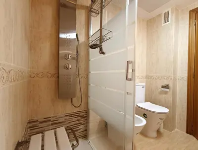 a bathroom with a toilet and a shower in it at Valencia Playa Patacona Resort in Valencia