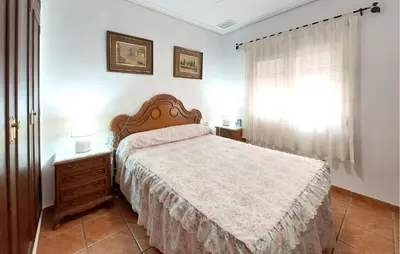 a bedroom with a bed and a window at Awesome Home In Bétera in Bétera
