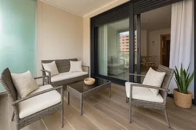 a living room with chairs and a table at Valencia Beach Home 8 in Valencia