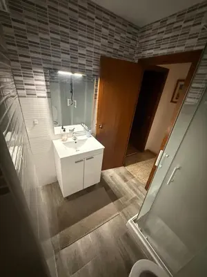a bathroom with a white sink and a mirror at EL Cid II in Valencia