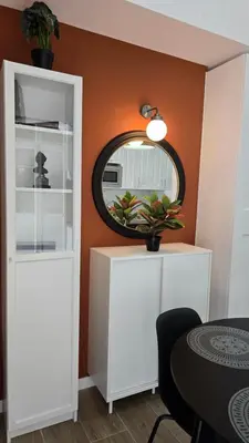 a room with a white cabinet and a mirror at Apartamentos Vicent Clavel in Valencia