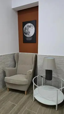 a living room with a couch and a glass table at Apartamentos Vicent Clavel in Valencia