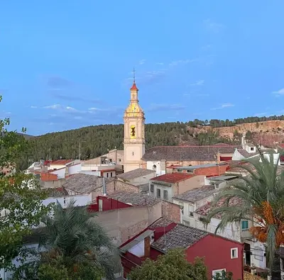 a city with a clock tower in the distance at El Surtidor in Anna