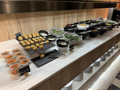 a buffet line of food on a table at Hotel Turia Valencia in Valencia