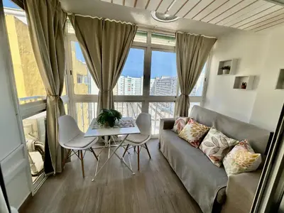 a living room with a couch and a table at Apartamento Bahía Cullera II in Cullera