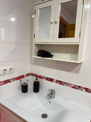 a bathroom with a sink and a mirror at Sweet Stay Valencia in Valencia