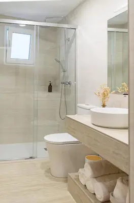 a bathroom with a shower and a toilet and a sink at Aromes d'Espadà in Eslida