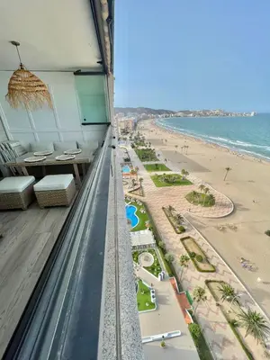 a view of the beach from the balcony of a resort at Sobre el mar in Cullera