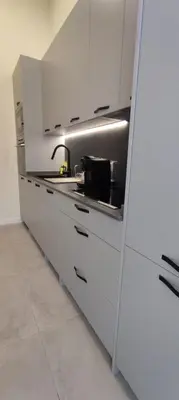 a kitchen with white cabinets and a sink at Illetes Flats - Suite cerca de Feria de Muestras y Metro in Valencia