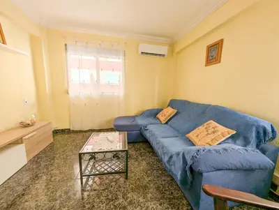 a blue bedroom with a bed and a white dresser at Brisa del Puerto in Puerto de Sagunto