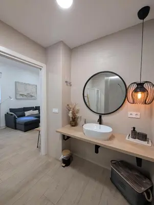 a bathroom with a sink and a mirror on the wall at Bonito loft para 4 personas in Valencia