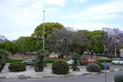 a street with cars parked in a parking lot at PinyaLabs Sunrise Valencia, mer & montagne à 10min in Puebla de Farnals