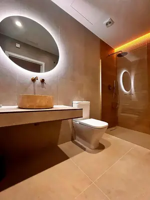 a bathroom with a toilet and a sink and a mirror at Pivote Flats-Puerto C in Valencia