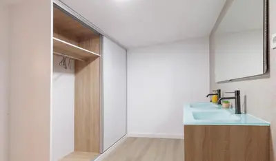 a bathroom with a sink and a mirror at Urban apartment 4 BAJO - Housevanlive in Valencia