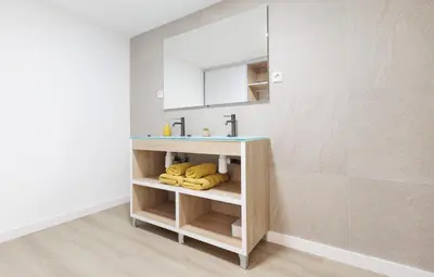 a bathroom with a sink and a mirror at Urban apartment 4 BAJO - Housevanlive in Valencia