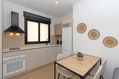 a kitchen and dining room with a table and chairs at GuestReady - Lovely stay in the Algirós area in Valencia