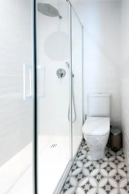 a bathroom with a shower with a toilet at La Casa del Mar-Cabañal 3BR Suites in Valencia