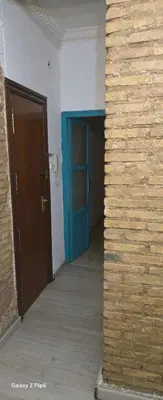 a hallway with a blue door in a building at Relax y bienestar in Valencia