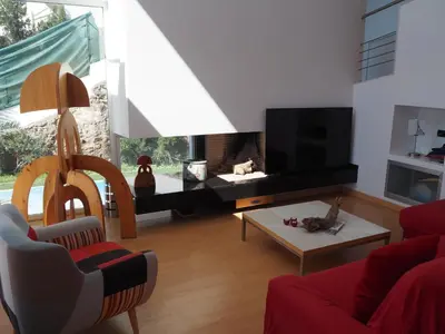 a living room with a couch and a tv at Brisas de Sierra Calderona in Gilet