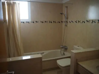a bathroom with a toilet and a tub and a sink at Brisas de Sierra Calderona in Gilet