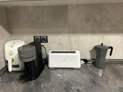 a kitchen counter with a toaster and a blender at Chalet encanto in Chiva