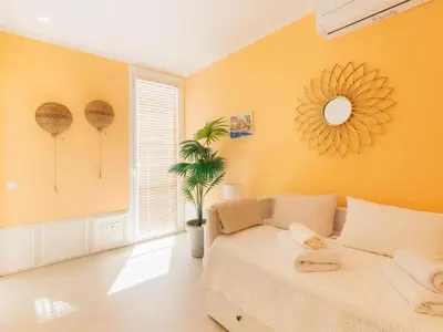 a bedroom with a bed and a mirror on the wall at Marsalada 2 - Apartment with sea view in Playa de Mar