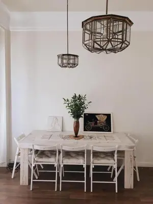 a dining room table with two chairs and a vase at Welcome to your Home in Valencia