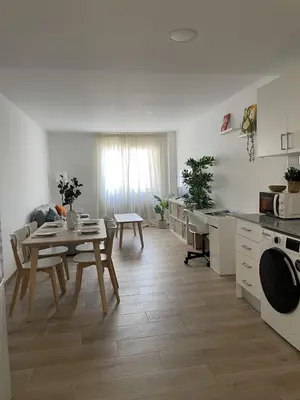 a kitchen and dining room with a table and a dining room at More than a lovely flat in Godella
