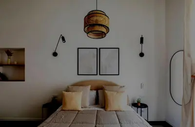 a bedroom with a bed and a pendant light at Apartamento Aleyda in Valencia