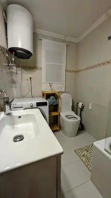 a bathroom with a white sink and a toilet at Apartment Sibi Cullera in Cullera