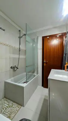 a bathroom with a tub and a shower and a sink at Apartment Sibi Cullera in Cullera