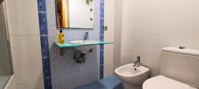a bathroom with a sink and a toilet at Apartamento cerca Playa in Puerto de Sagunto